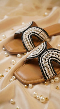 Kaaya Black White Pearl Swirl Slide Flats by Radiarte – Flat Lay with Pearls