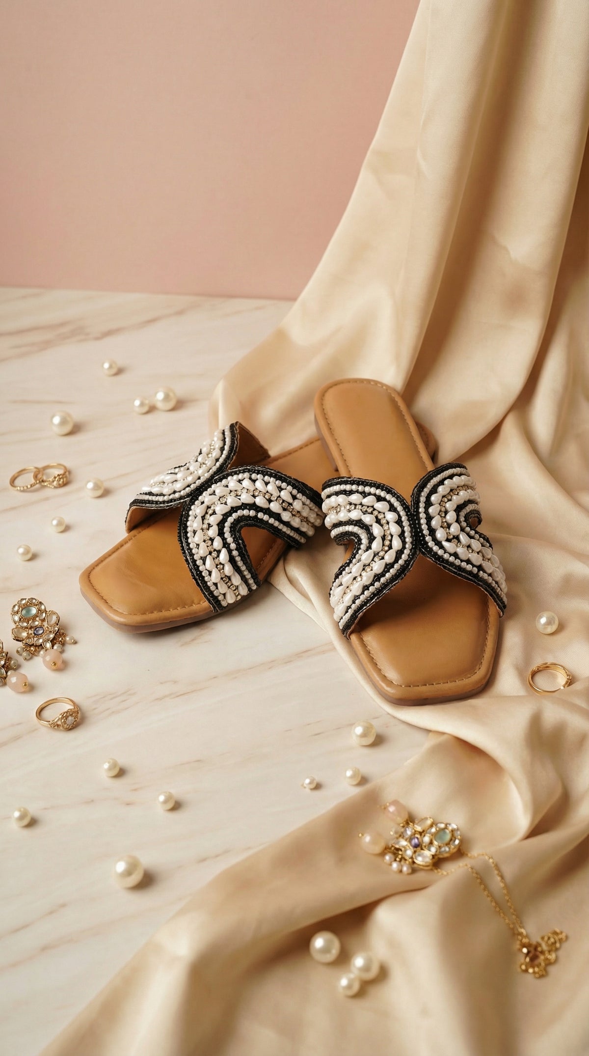 Kaaya Black White Beaded Slide Flats – Side View with Marble & Silk Backdrop by Radiarte