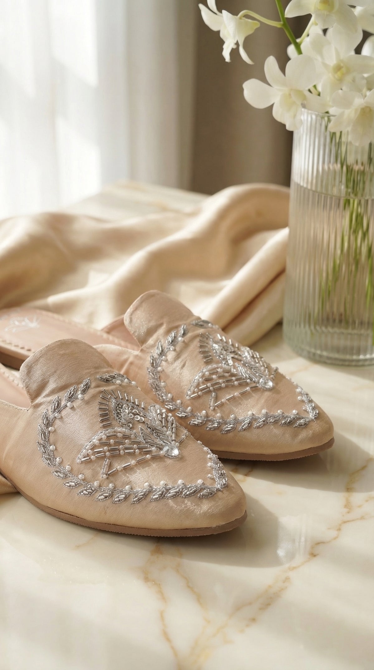 Close-up of silver zardozi hand embroidery on Radiant nude mule flat – Radiarte