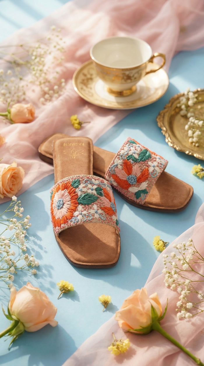 Phool Multicolour Floral Embroidered Slide Flat by Radiarte – Flat Lay on Sky Blue with Peach Roses & Teacup