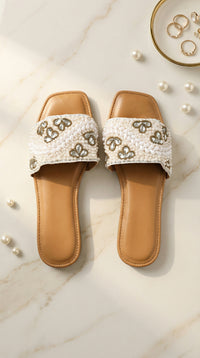 Zaariya white pearl crystal slide flat by Radiarte – top view flat lay on marble with scattered pearls and gold rings