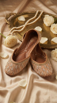 Noor Handcrafted Zardozi Jutti – Side View with Gold Tray, Pearl Necklace & White Roses by Radiarte