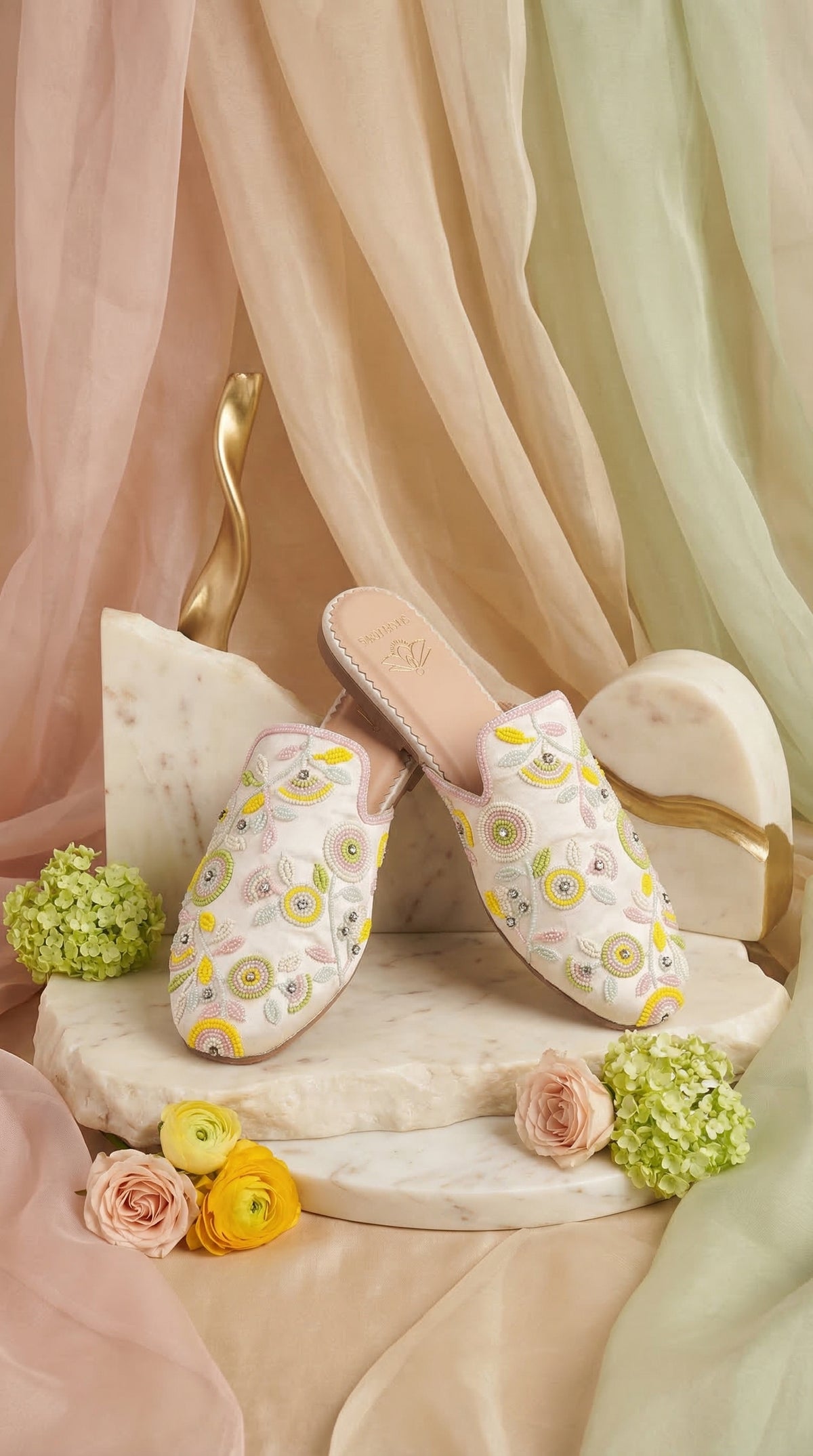 Daisy White Pastel Mule – Side View on Marble Stand by Radiarte