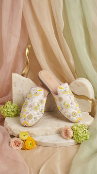 Daisy White Pastel Mule – Side View on Marble Stand by Radiarte