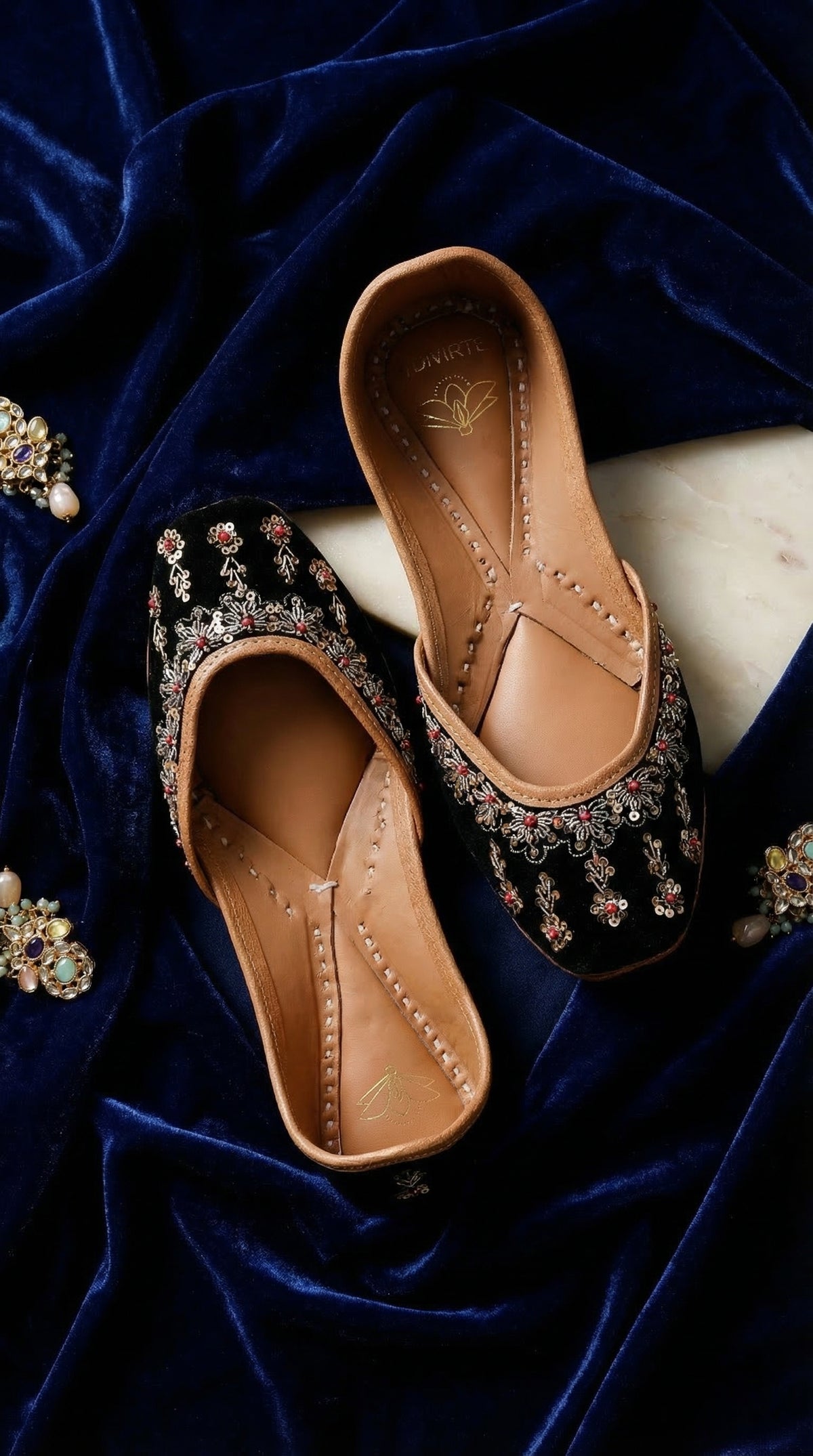 Zehra handcrafted black velvet ruby stone jutti – top view on navy velvet with multicolour gem earrings Radiarte