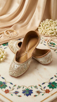 Tara gold zardozi pearl jutti – side view on pietra dura marble with pearl bangles and mogra garland Radiarte