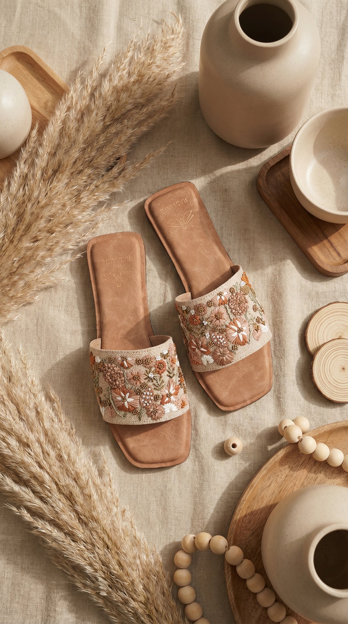 Vriksha handcrafted wildflower bead slide flat – top view flat lay on linen with pampas and wooden accents Radiarte