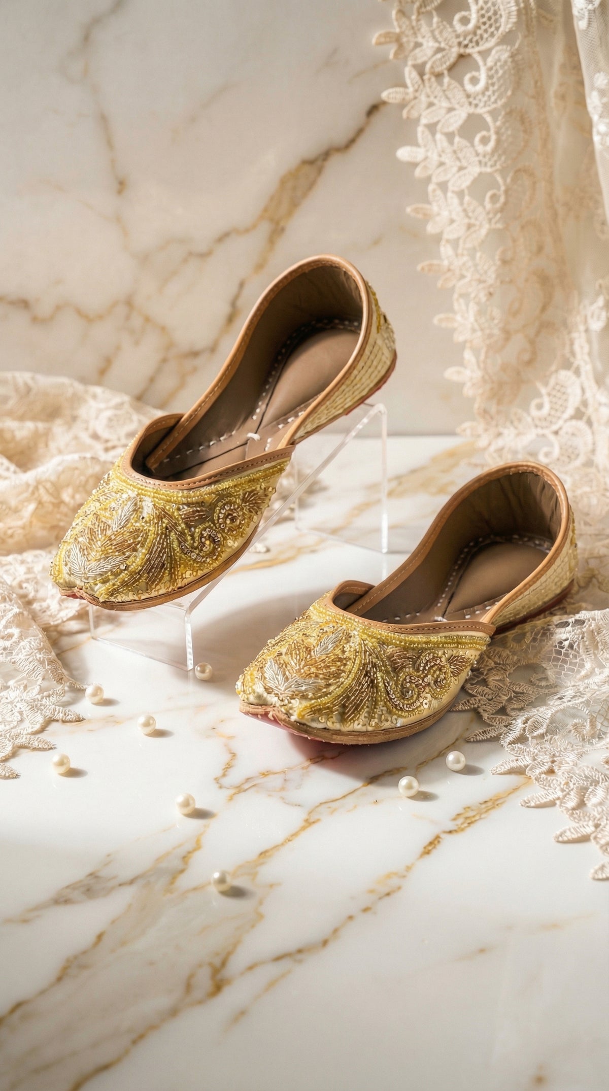 Shararat gold zardozi embroidered jutti by Radiarte – pair on marble with pearls and ivory lace