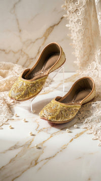 Shararat gold zardozi embroidered jutti by Radiarte – pair on marble with pearls and ivory lace