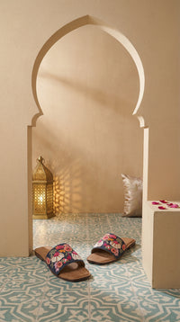 Rangrez navy embroidered slide flat pair – Moroccan arch setting with warm lantern light by Radiarte