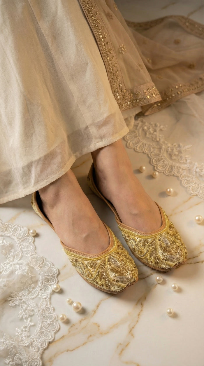 Shararat gold embroidered jutti on feet – worn with ivory chanderi kurta set close-up by Radiarte