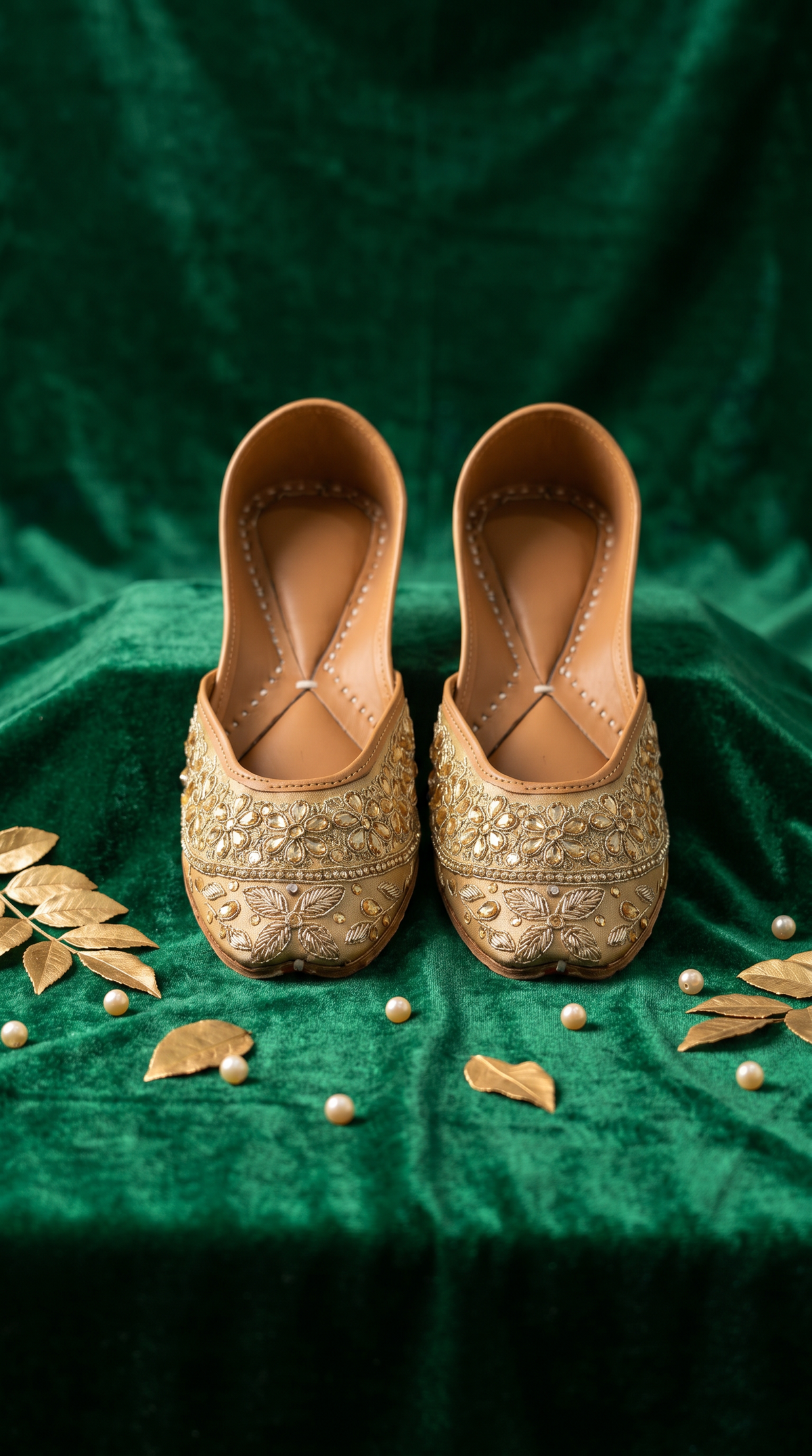 Zarrin gold zardozi embroidered jutti pair on emerald green velvet with gold leaves and pearls