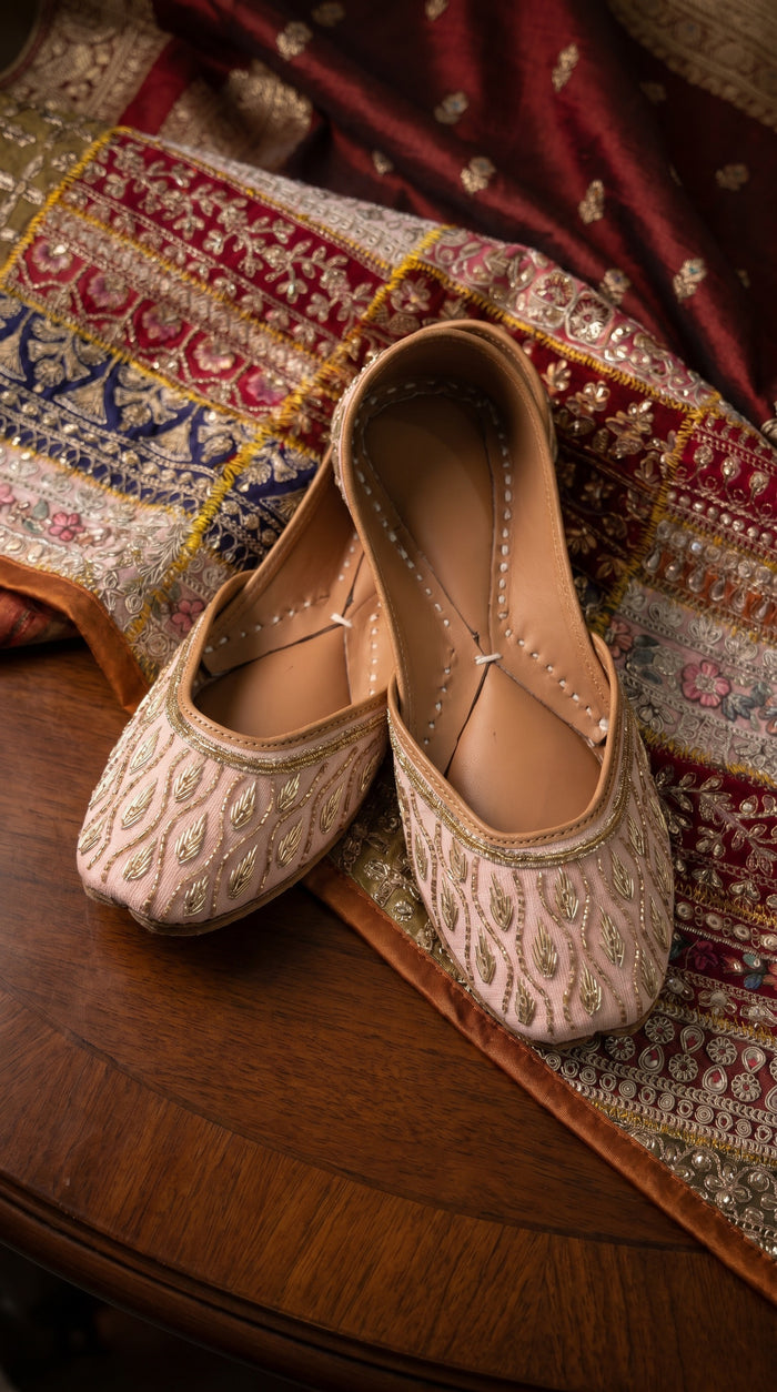 Pallavi handcrafted jutti – angled top view showing gold leaf beadwork