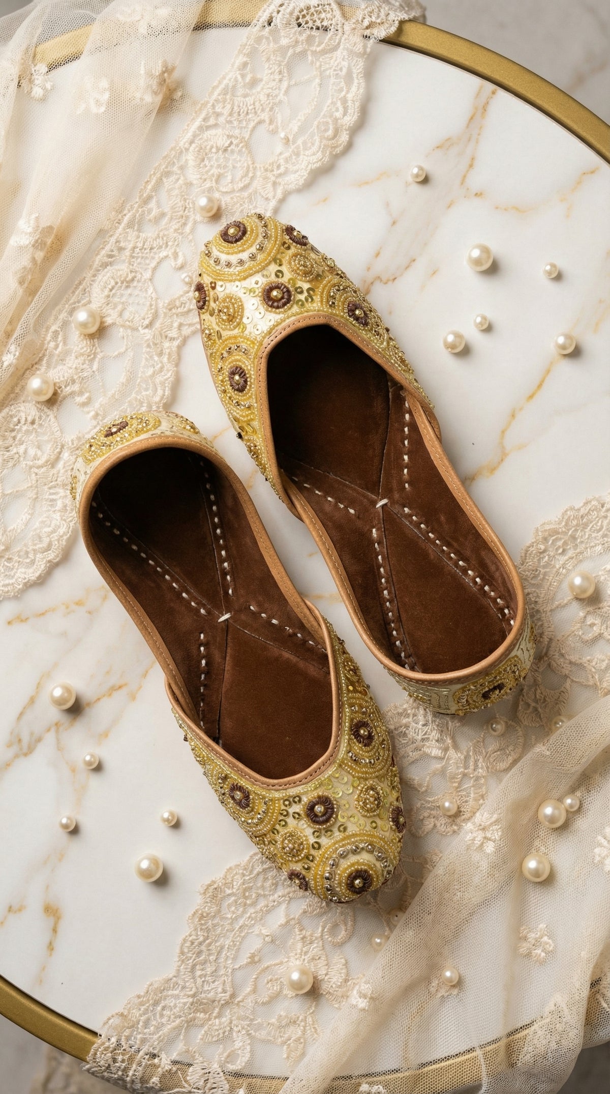 Ghumaar Handcrafted Gold Jutti – Top View on Marble with Pearls by Radiarte