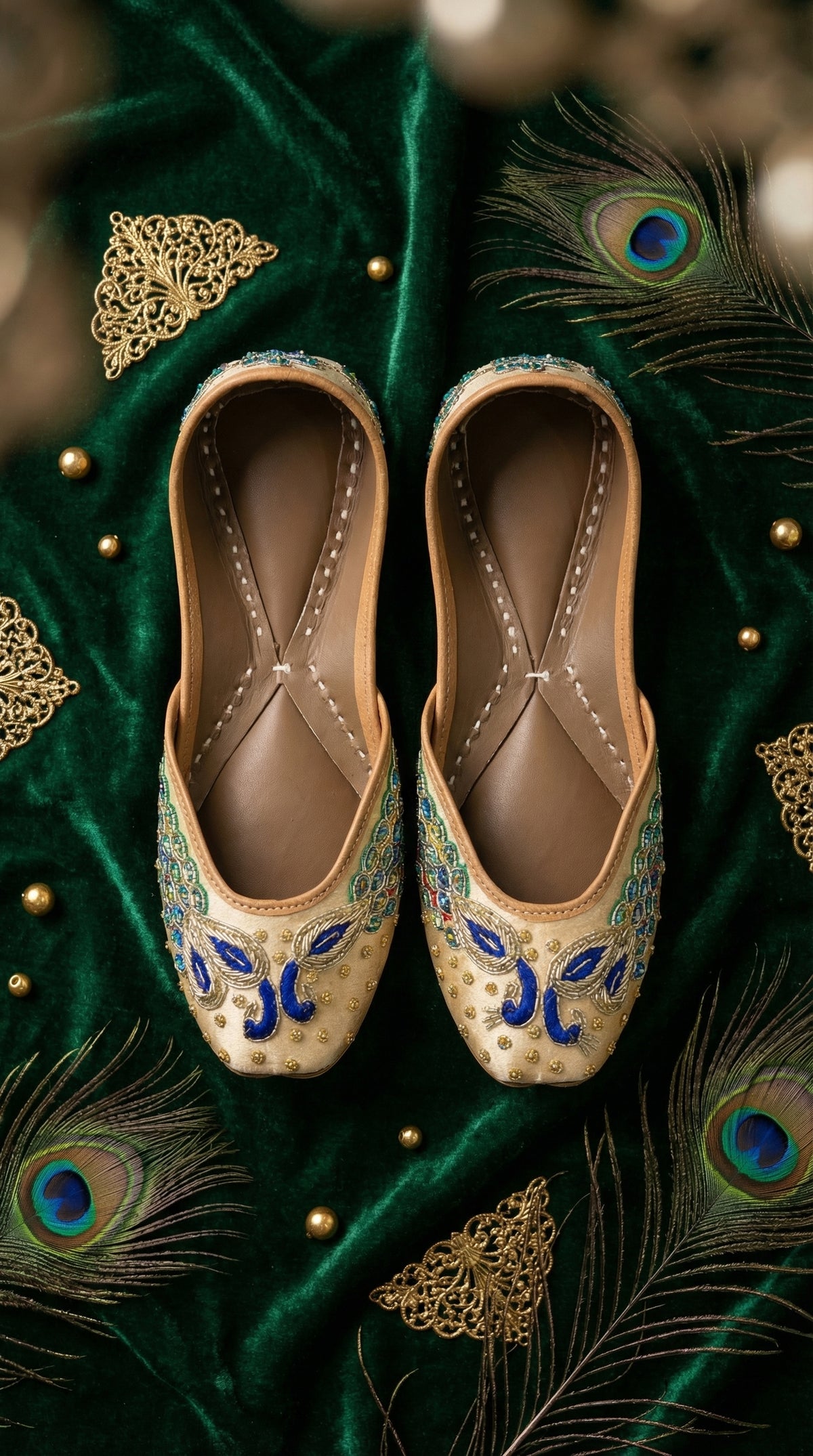 Morni Cream Royal Blue Peacock Jutti Pair – Top View on Emerald Velvet by Radiarte