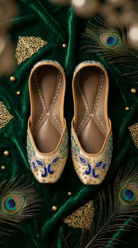 Morni Cream Royal Blue Peacock Jutti Pair – Top View on Emerald Velvet by Radiarte