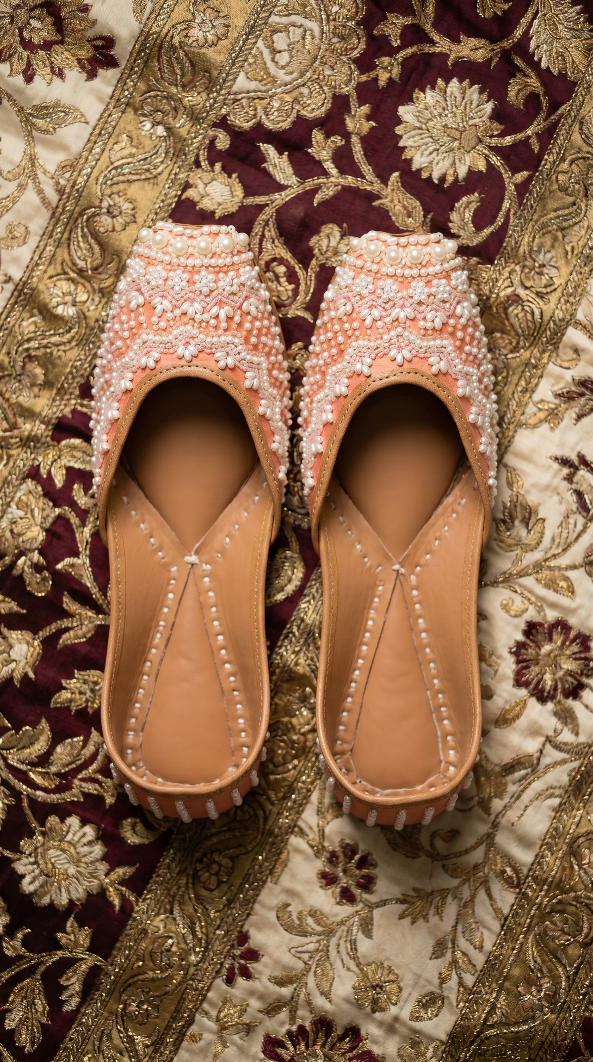 Moti Peach Jutti – Top view showing intricate pearl and bead embroidery
