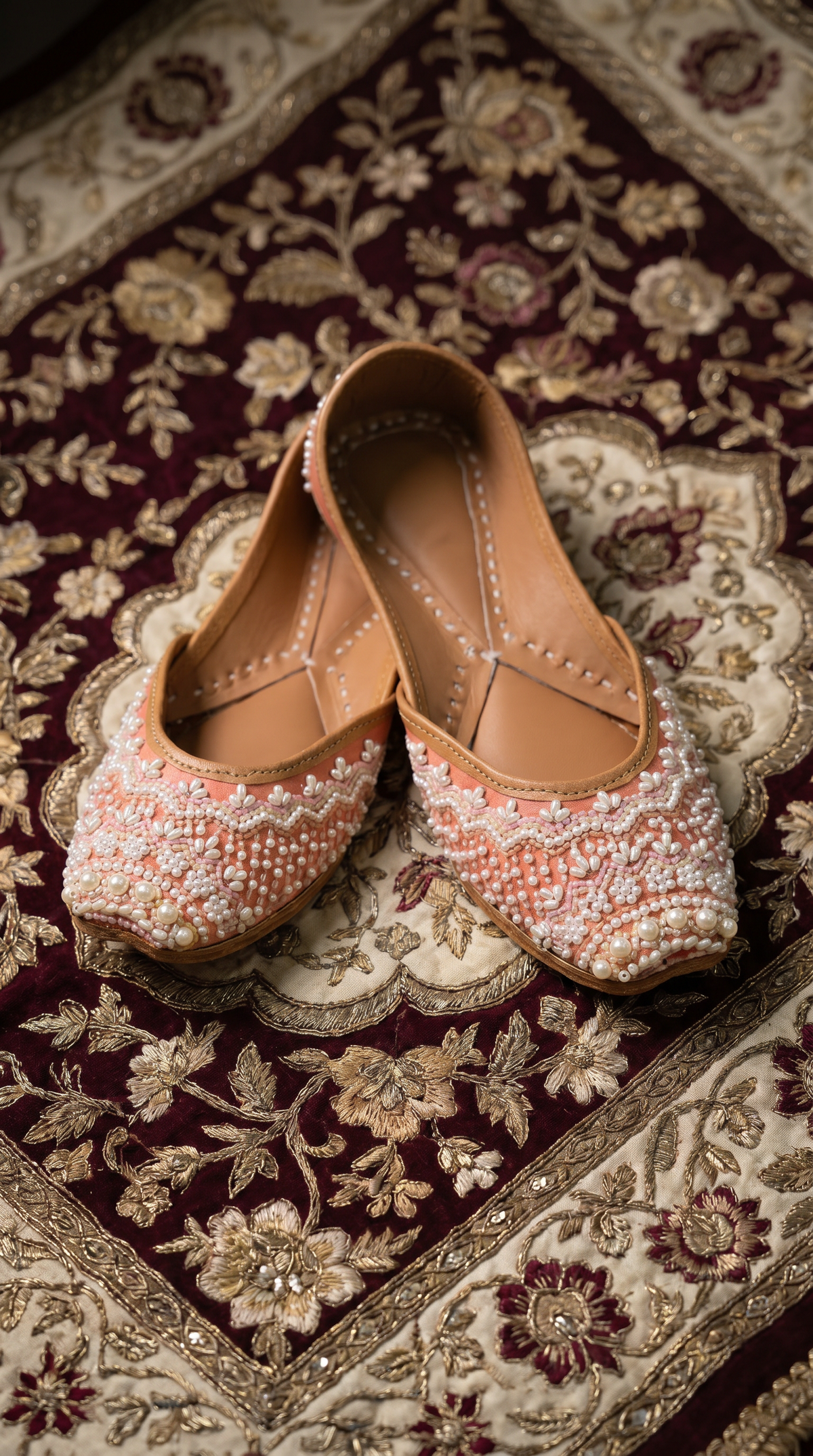 Moti Peach Pearl Jutti by Radiarte – Side angle display on bridal fabric