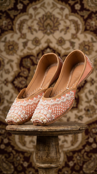 Moti Peach Beaded Jutti by Radiarte – Display on wooden stand