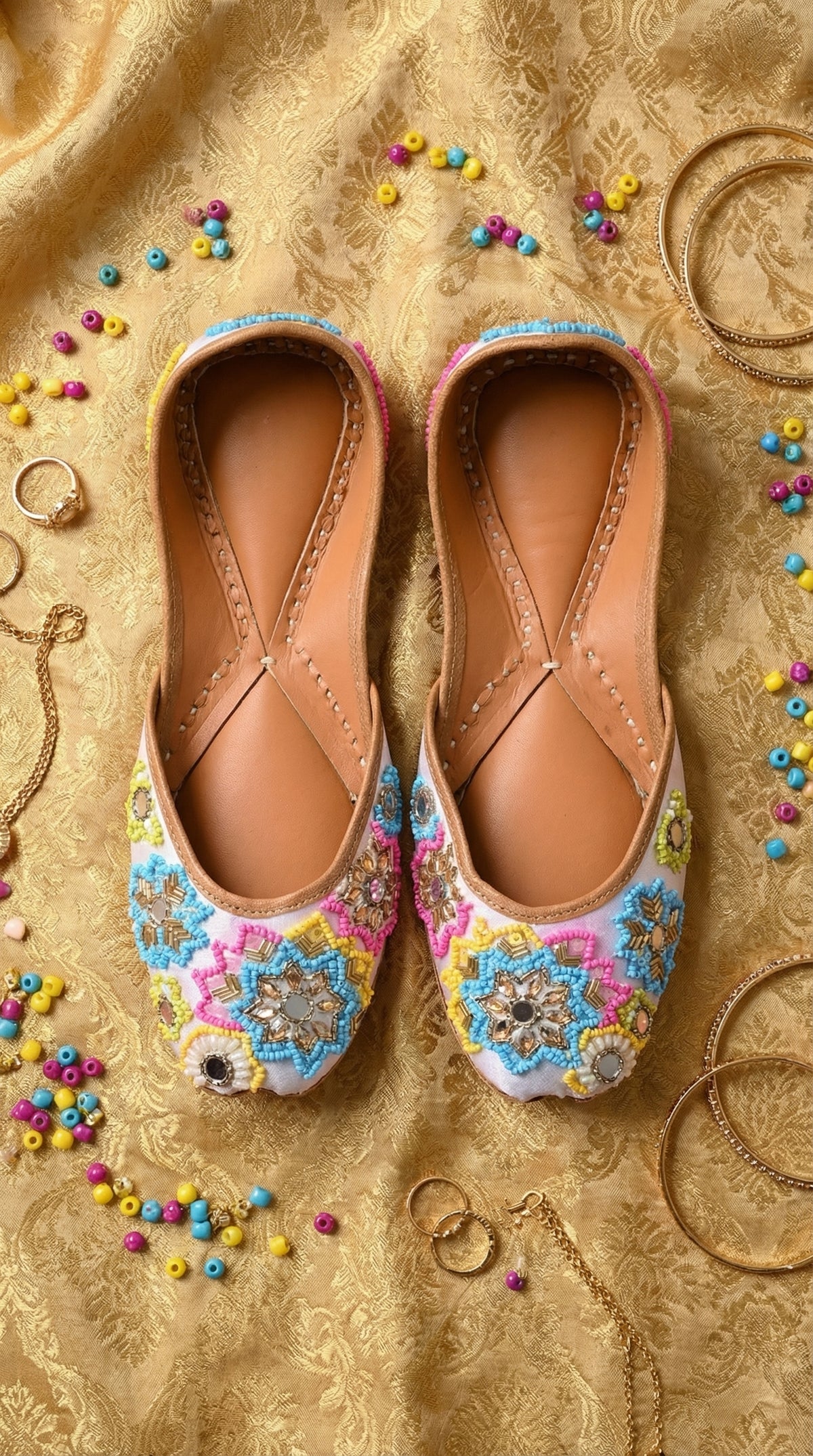 Meher White Multicolour Beaded Jutti Pair – Top View with Colourful Beads & Bangles by Radiarte