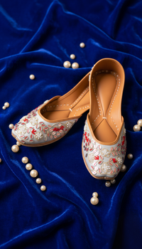 Samundar bridal jutti pair – side angle on royal blue velvet with pearl scatter by Radiarte